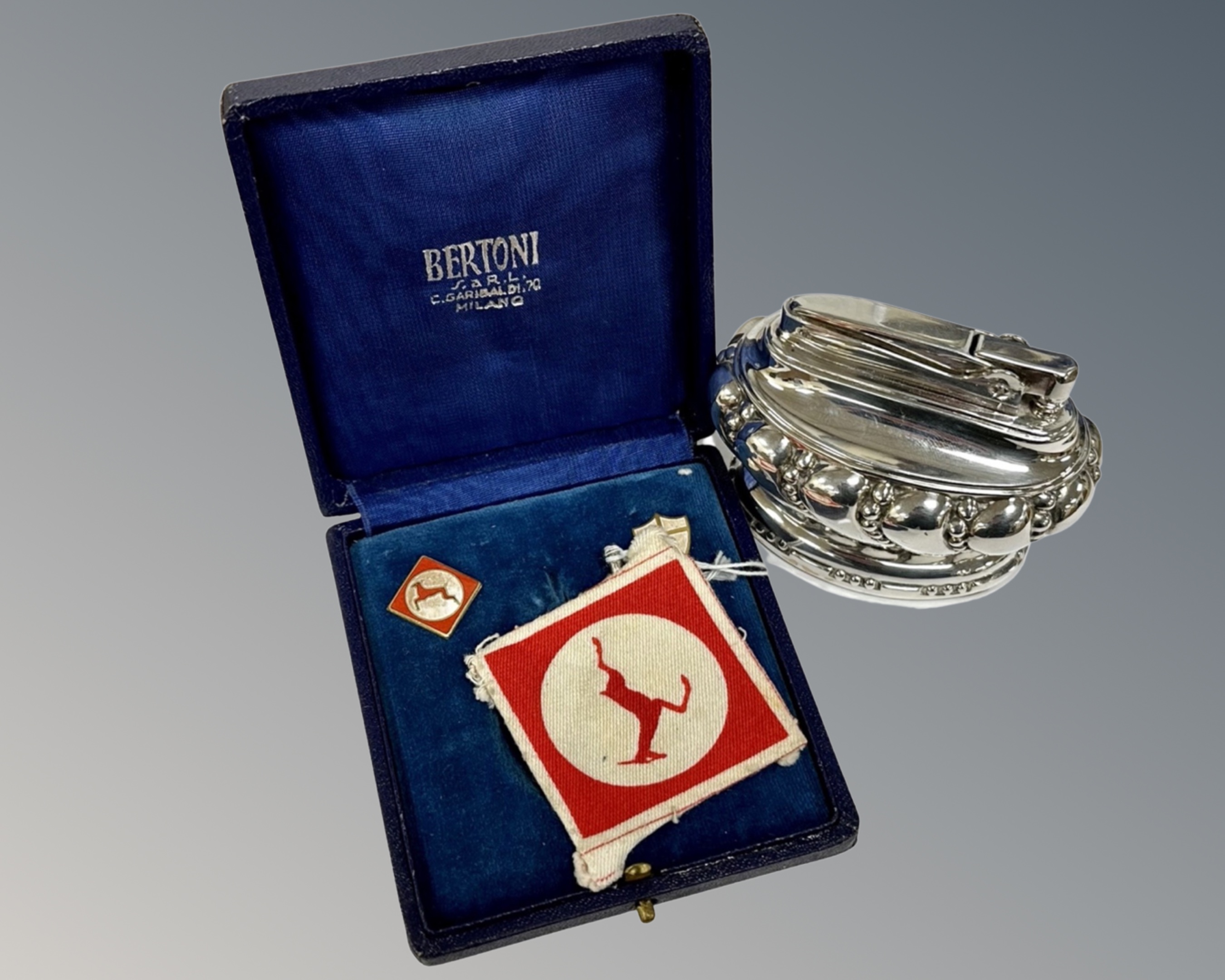 A Ronson 'Crown' table lighter together with a cased sporting medallion.