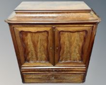 A 19th century continental mahogany double door cocktail cabinet fitted with two drawers beneath.