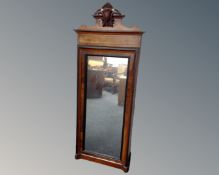 A 19th century continental walnut and ebonised hall mirror.
