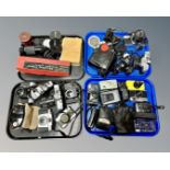 A collection of vintage SLR and point and shoot cameras including a Nikon AF600,