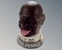 A cast iron novelty Smilin' Sam Salted Peanuts money box.