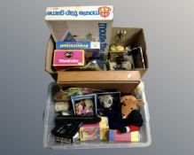 Two boxes containing vintage board games, meerkat soft toys, Harry Potter books etc.