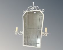 A cast iron framed leaded glass wall mirror with sconces.