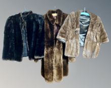 A mink fur cape together with a sealskin coat, a mink fur stole, in box, and a simulated fur coat.