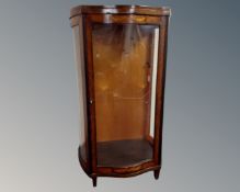 A 20th century inlaid rosewood and mahogany French serpentine fronted display cabinet with perspex