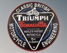 A cast iron Triumph Bonneville wall plaque.