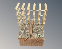 A wine rack together with a sewing basket.