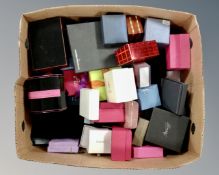 A box containing a large quantity of jewellery boxes.