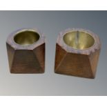 A pair of oak ash trays lined in brass formed from WWI bullet casings.