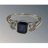 An 18ct yellow gold two stone diamond and sapphire ring, size N.
