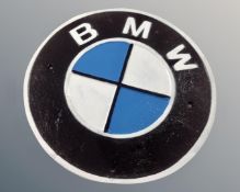 A cast iron BMW wall plaque.