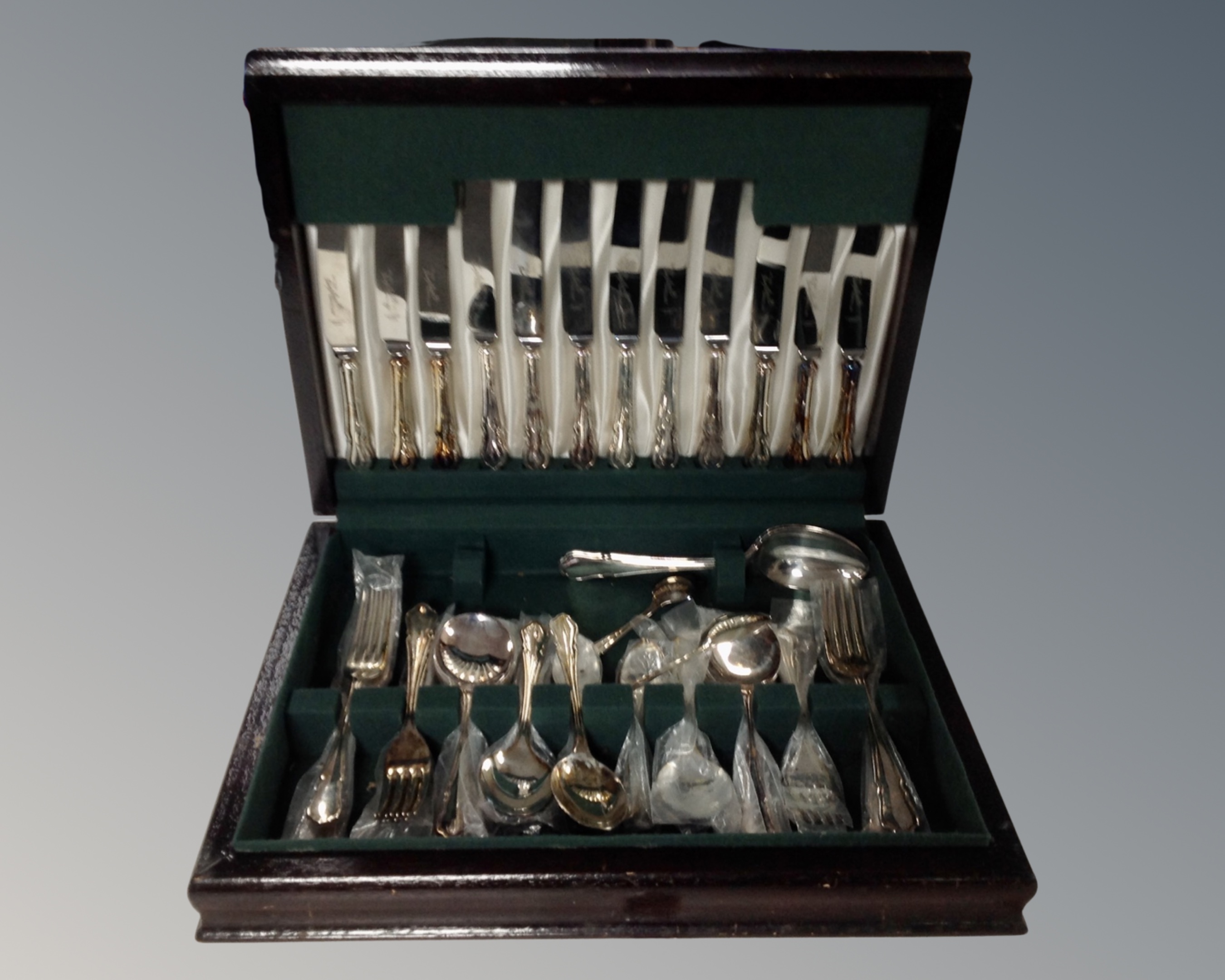 A canteen of Sheffield stainless steel plate-handled cutlery.