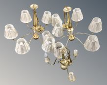 A pair of contemporary brass six way light fittings, with shades,