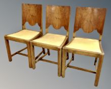 A set of three mid-20th century walnut panel back dining chairs by Cox & Falconer of Darlington.