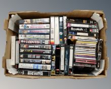 A box containing VHS cassettes, pre-recorded cassettes and CDs including Neil Young,