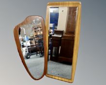 A mid-century frameless mirror mounted on a teak board together with a further formwood mirror.
