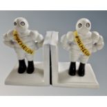 A pair of cast iron novelty Michelin Man bookends.