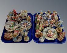 Two trays containing a collection of Cherished Teddies Christmas figures and plaques.