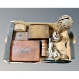 A box containing assorted table boxes, an elephant cigarette box, silver plated table lamp,