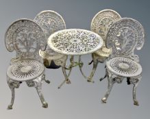 A painted cast metal circular patio table together with four chairs CONDITION REPORT: