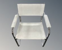 A contemporary white leather and chrome armchair.