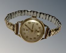 A 9ct yellow gold lady's wristwatch by Cyma, on expansion bracelet.