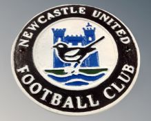 A cast iron Newcastle United FC wall plaque.