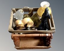 A vintage wooden crate containing a converted oil lamp, a metal figure of William the Conqueror,