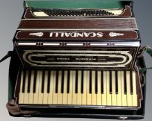 A Scandalli Vibrante III piano accordion in case.
