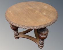 A 20th century circular oak occasional table on bulbous legs.