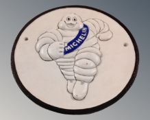 A cast iron Michelin Man wall plaque.