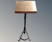 An early 20th century oak lectern on cast iron stand.