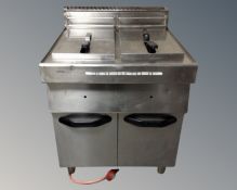 A stainless steel commercial double fryer.