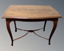 A 20th century mahogany shaped occasional table.