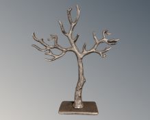 A cast iron jewellery stand in the form of a tree.