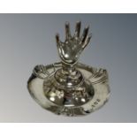 A silver ring stand, 1912 Birmingham hallmarks, height 7cm.