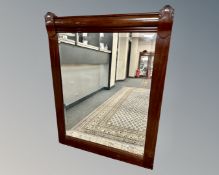An early 20th century mahogany framed bevelled mirror, 102cm by 135cm.