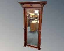 A 19th century mahogany hall mirror with pillar column supports.