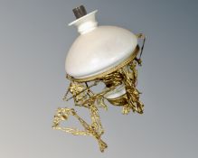 An antique gilt metal rise and fall oil lamp, with chimney and shade.