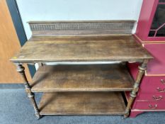 A 19th century oak three tier dumbwaiter.