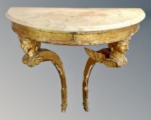 A 19th century giltwood D-shaped marble topped console table, width 78 cm, heigth 84 cm.