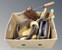 A box containing a vintage wooden block and tackle with rope together with a vintage woodworkers