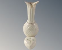 A Belleek vase together with a heart shaped lidded trinket pot.