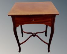 A 19th century mahogany work table on cabriole legs.