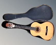 A Hohner model HC-06 acoustic guitar in carry case.