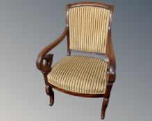 A 19th century mahogany scroll armchair in striped upholstery