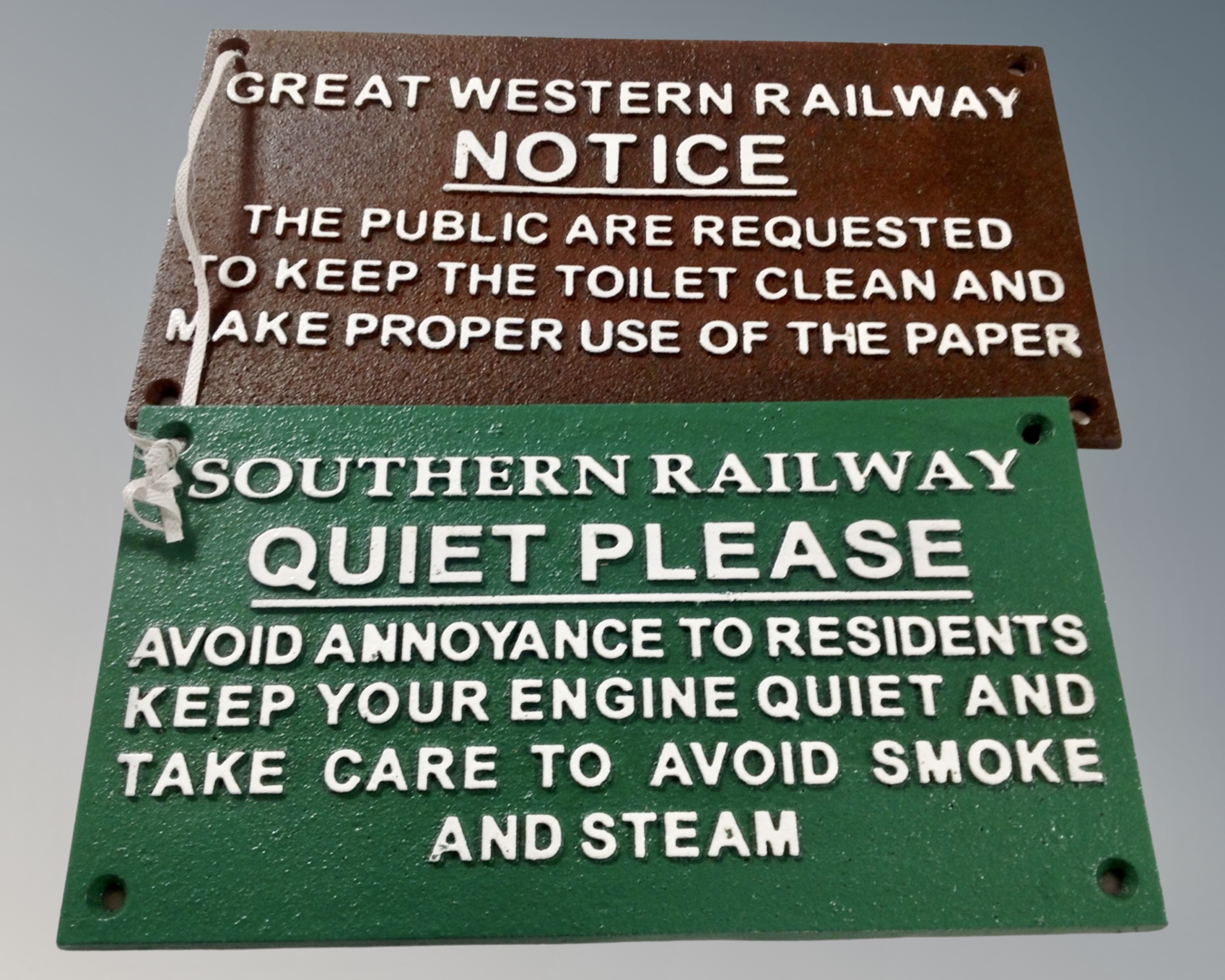 Two cast iron railway plaques, Quiet Please and Notice.