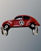 An aluminium VW Beetle two hook coat rack.