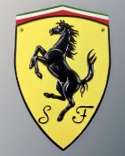 A cast iron Ferrari wall plaque.