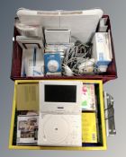 Two crates containing CDs, a portable DVD player, Nintendo Wii with leads, controller,